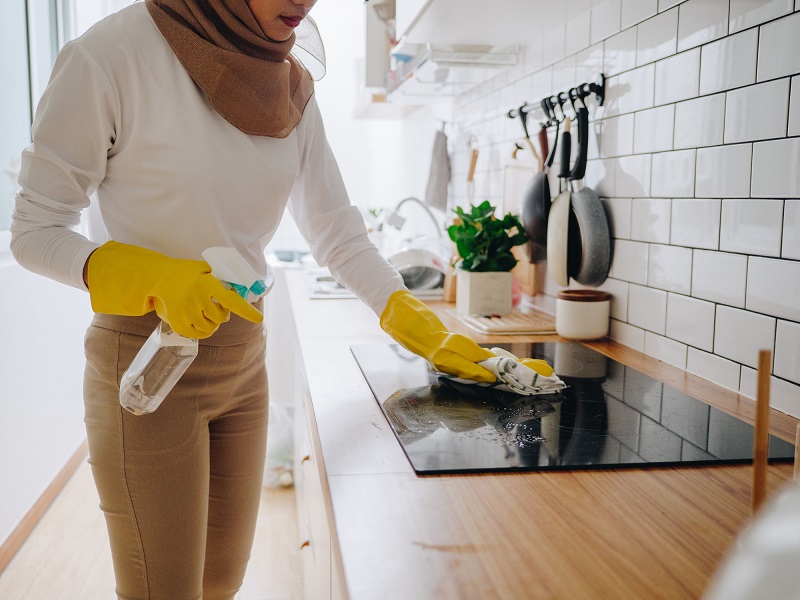 Stock image of cleaning an induction hob