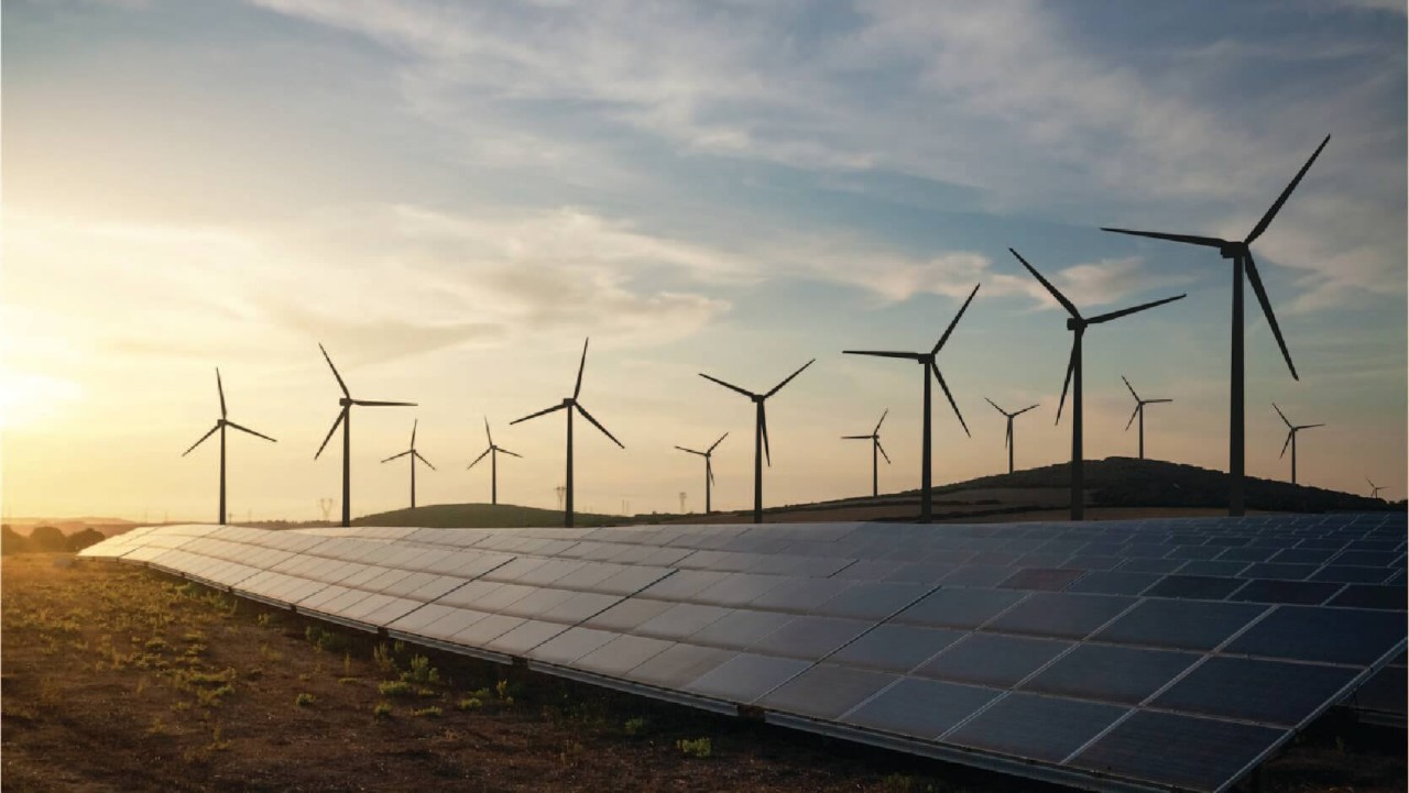 Stock image of solar panels and wind turbines