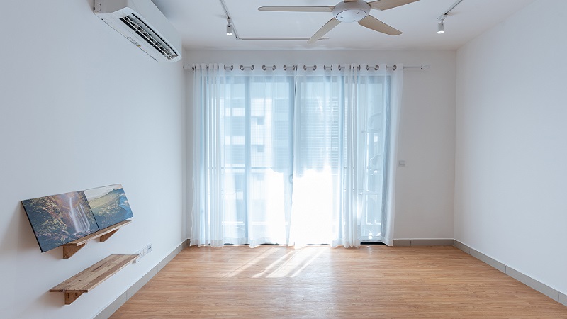 Stock image of a room with light-coloured curtains