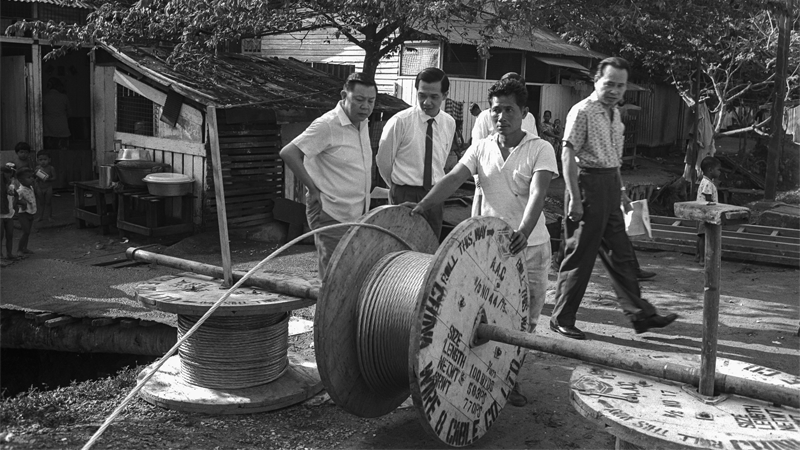PUB board members checking works carried out under the electrification scheme to supply electricity (Photo credit: Ministry of Information and the Arts Collection, courtesy of National Archives of Singapore)