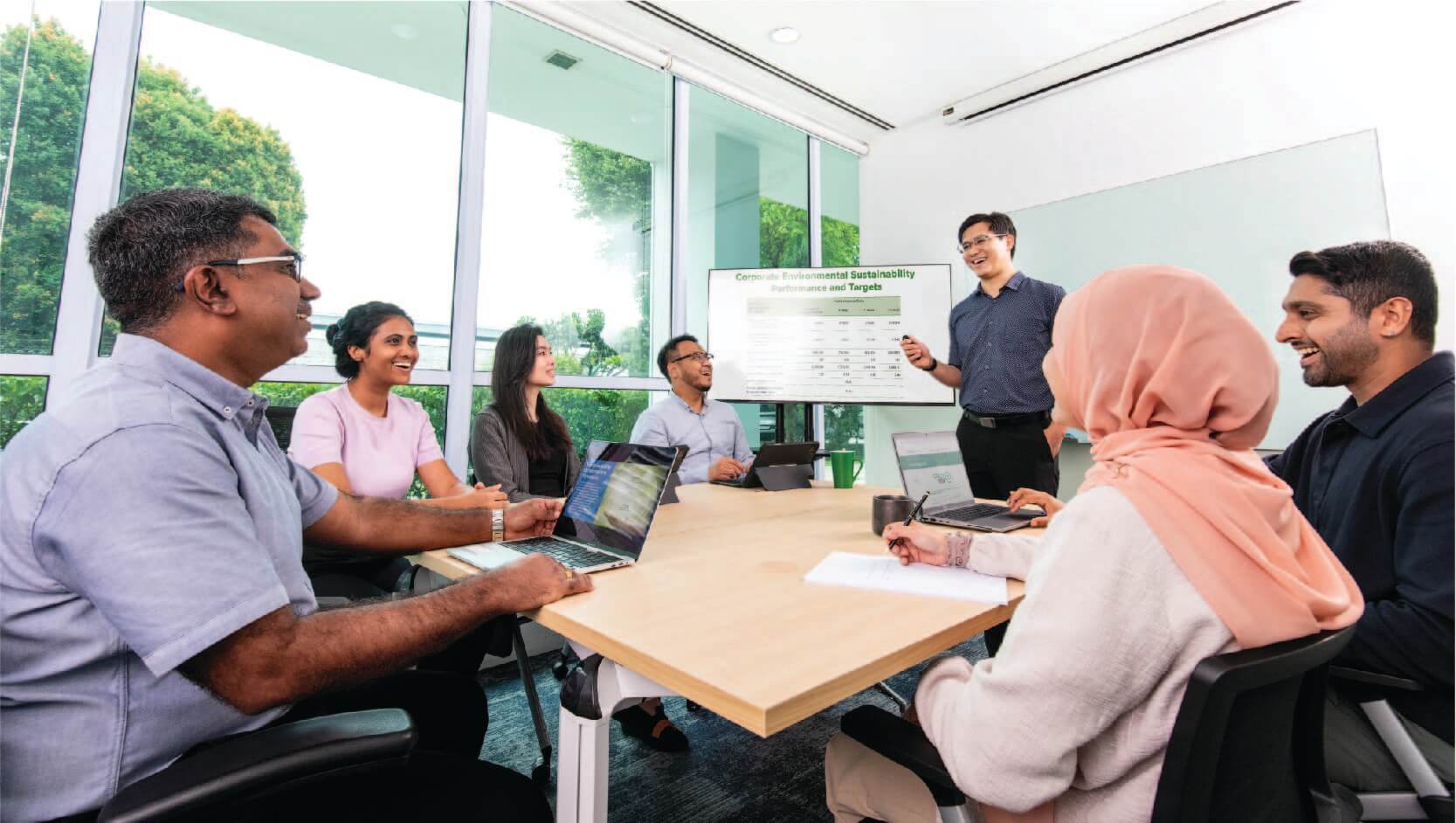 Photo of EMA employees discussing about sustainability efforts